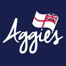 The word Aggies is written in white cursive on a dark blue background, with a white flag featuring a red cross and a Union Flag in the corner above the text.
