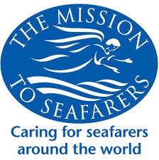 Blue oval logo with a winged angel above waves and text: The Mission to Seafarers. Below, it reads: Caring for seafarers around the world.
